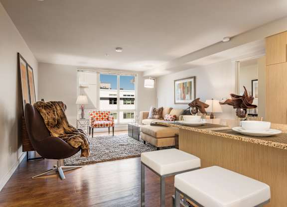 Open concept living area with breakfast bar at The Lyric Apartments, Seattle, WA 98102