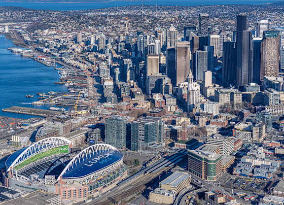 an aerial view of the city with the convention center and the stadium