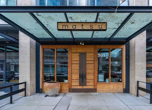 the front of the mastu building in the city