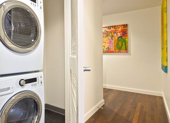 a washer and dryer in a laundry room next to a door