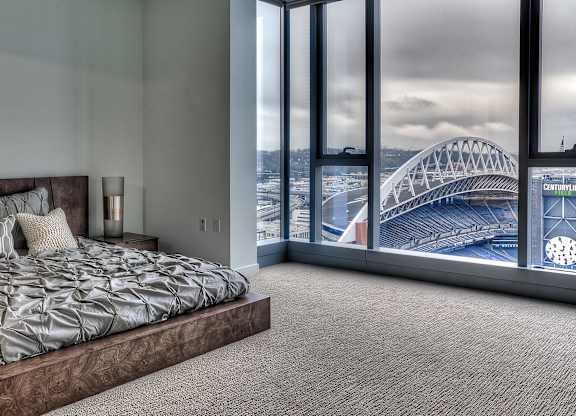 a bedroom with a view of the sydney harbour bridge