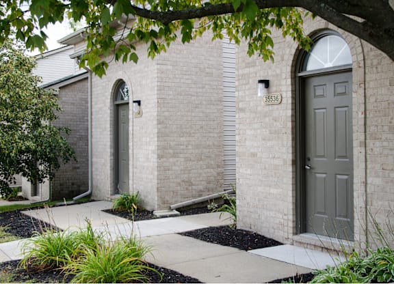 House with grey door at Woodland Meadows, Clinton Township, 48035