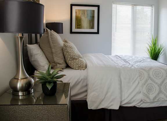 Bedroom with Nightstand at Pine Ridge Apartments, Rochester Hills, MI, 48307