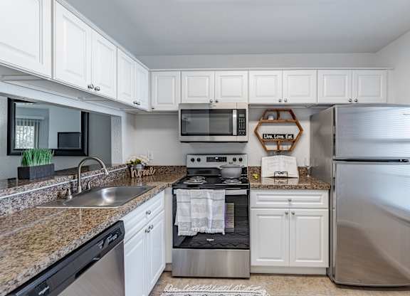 Kitchen with Cabinets at Hidden Lakes Apartments, Clarkston, Michigan