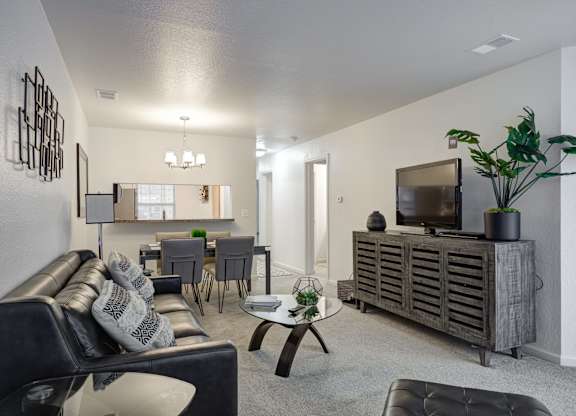 Living Room with TV at Hidden Lakes Apartments, Michigan, 48346