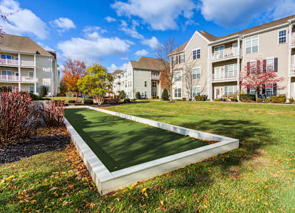 A green lawn in front of apartment buildings at Meridian West Shore, Mechanicsburg Pennsylvania