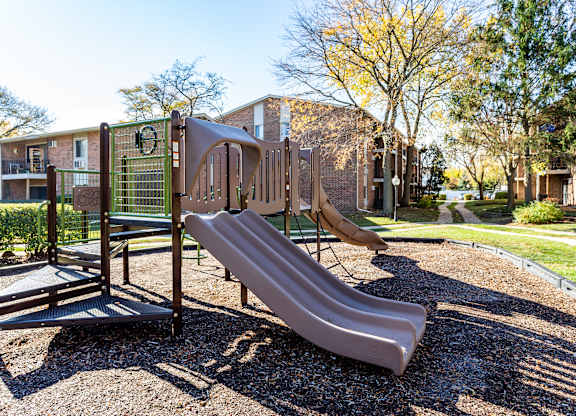 Playground with a slide at fifty9 Grove Apartments, Naperville, IL