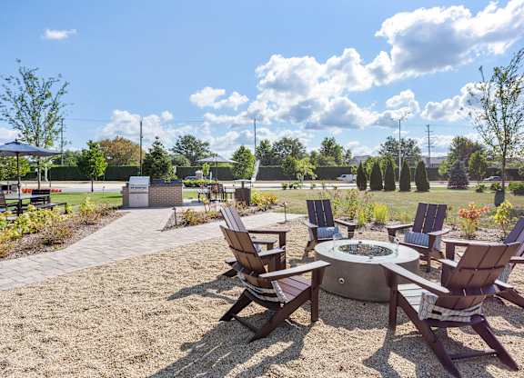 Patio with outdoor grilling stations at fifty9 Grove Apartments, Naperville, IL, 60563