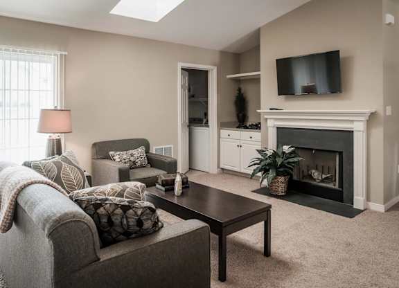 Living Room With TV And Fireplace at Highlands at Warwick Apartments, Lilitz, PA