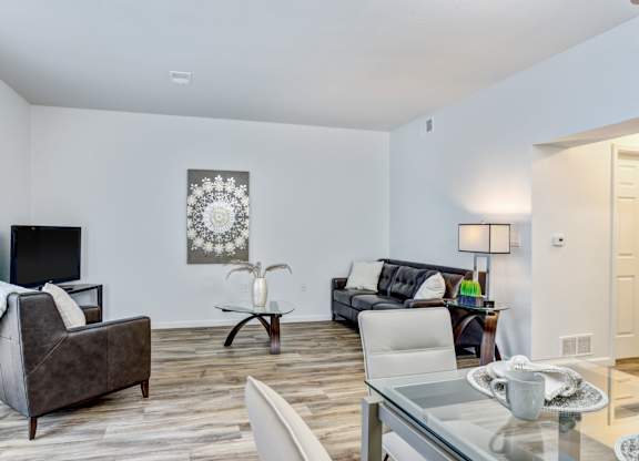 Living room with couch and tv at Woodland Meadows, Michigan, 48035