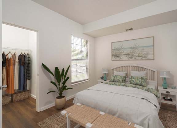 Bedroom with bed and closet at Woodland Meadows, Clinton Township, MI, 48035