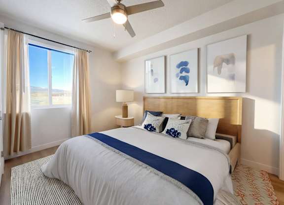 Liberty Sage Apartments, Park City, Utah, a bedroom with a large bed and a ceiling fan.