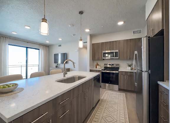 Liberty Sage Apartments, Park City, Utah, a modern kitchen with a large island and stainless steel appliances.