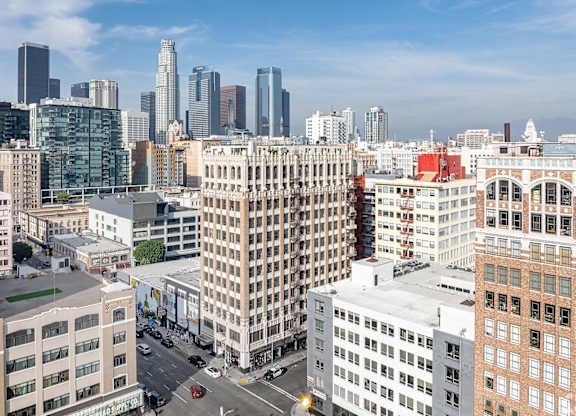 A cityscape with a mix of modern and older buildings.
