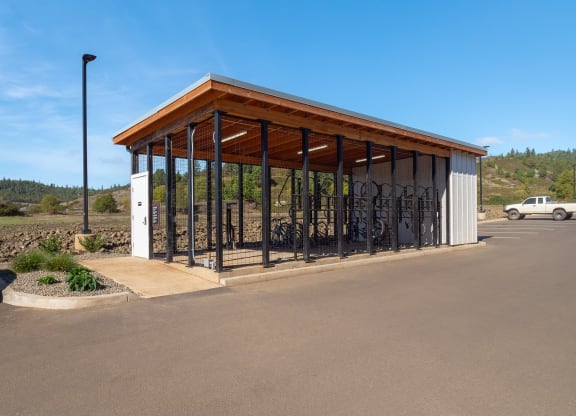 a bike rack in a parking lot next to a building
