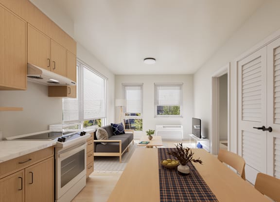 A modern kitchen with wooden cabinets and a dining table set for two.
