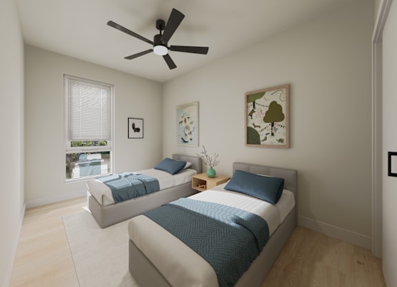 A bedroom with two beds and a ceiling fan.