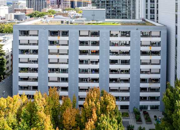 an aerial view of a large building surrounded by trees
