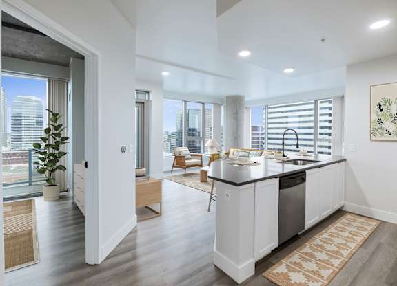 A modern kitchen with a view of the city.