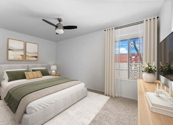 A bedroom with a bed, nightstand, and a window with a view of a city.