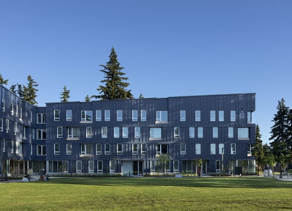 a view of the building with a grassy area in front of it