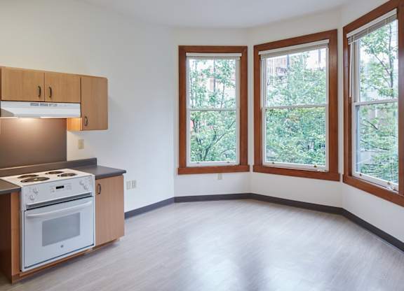 A kitchen with a stove and cabinets.