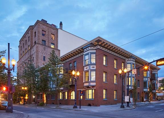 A street view of a building with a sign that reads "Nash".