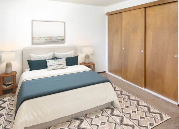 a bedroom with a bed and a wardrobe