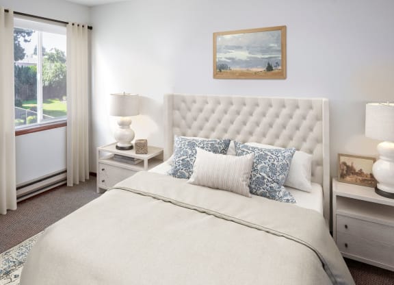 a bedroom with a bed and two night stands