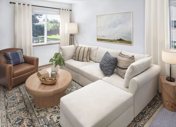 a living room filled with furniture and a large window