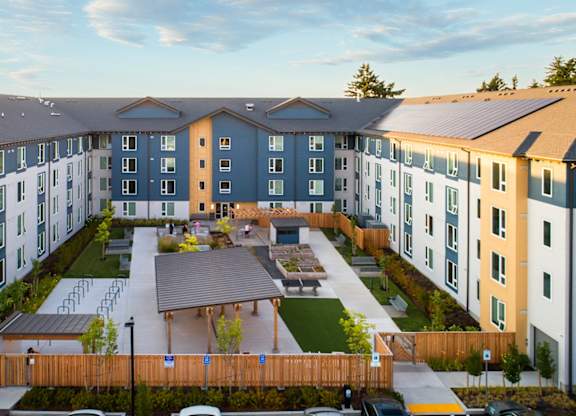 A large apartment complex with a courtyard in the middle.