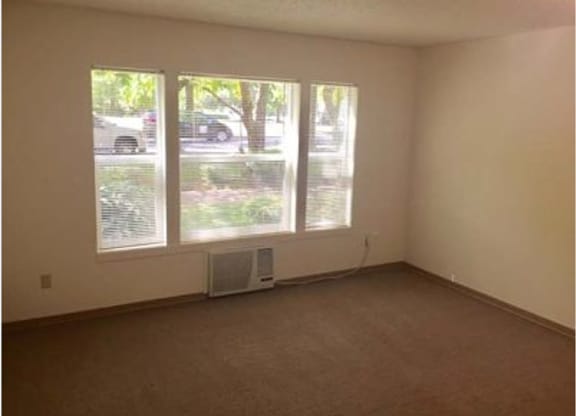 an empty room with a large window in it
