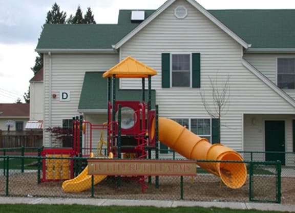a playground in front of a house