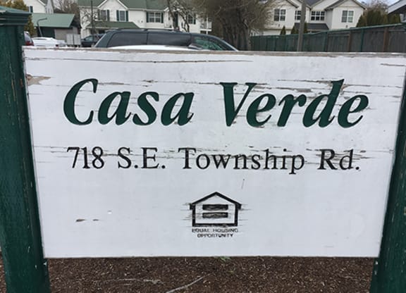 a sign in front of a street