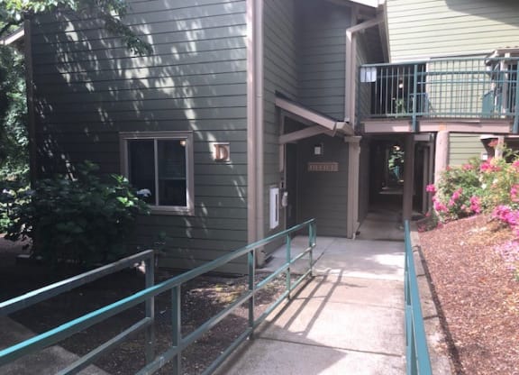 a house with a porch and a walkway