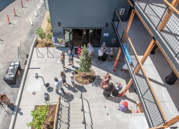 a group of people standing outside of a building