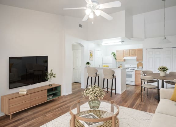 a living room with a couch and a table with chairs