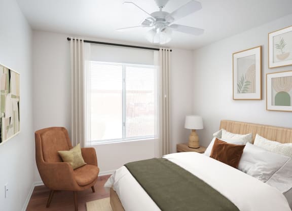 a bedroom with a bed and a chair and a ceiling fan