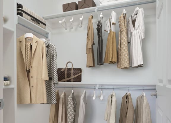 a closet with a rack of clothes in it
