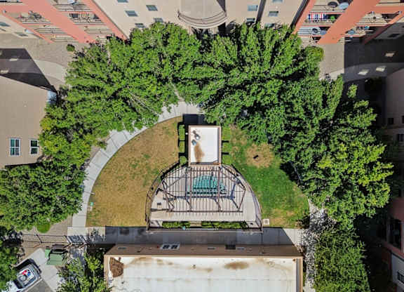 A bird's eye view of a courtyard surrounded by buildings.