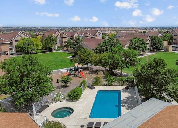 A view of a swimming pool from a balcony.