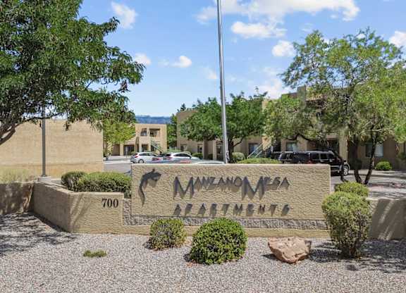 The image shows a sign for Navajo Casino in front of some buildings.
