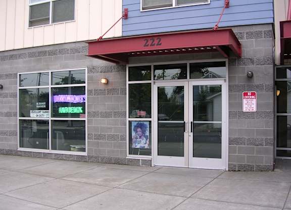 A building with a red awning and a window that says "DINNERMATE" on it.