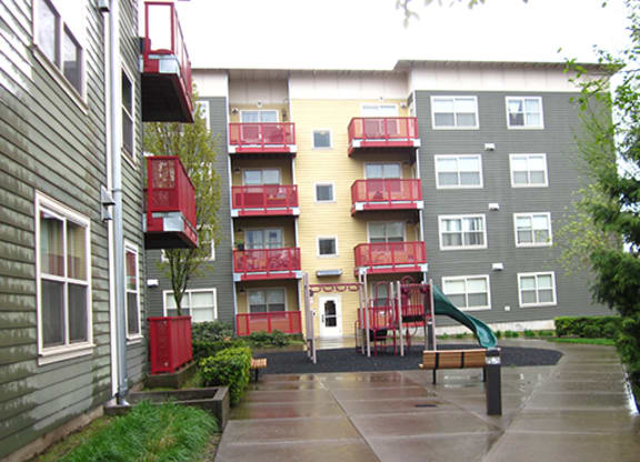 a rainy day in front of an apartment building