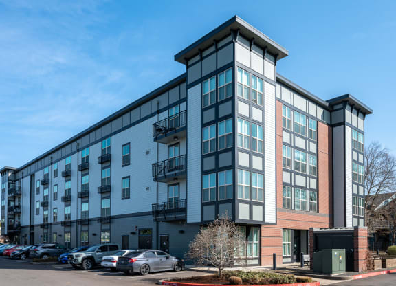 a large building with a parking lot in front of it