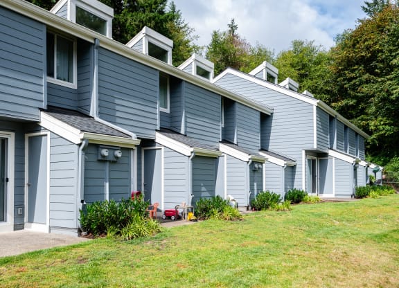 a row of blue houses with blue siding