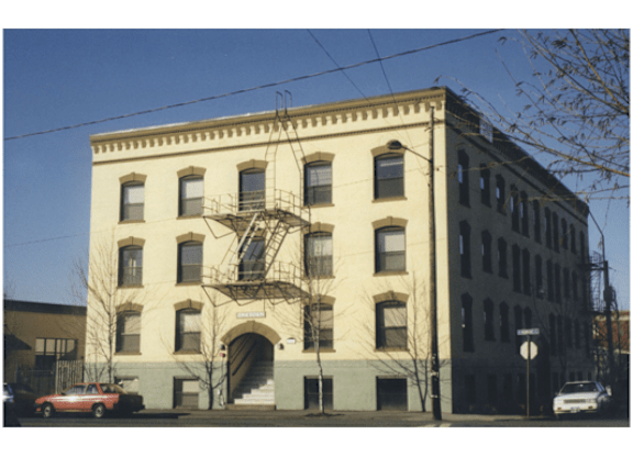 A large building with a fire escape on the side.