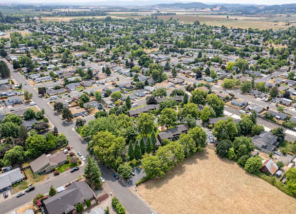 A residential area with houses and trees.