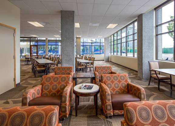 A room with a table and chairs.