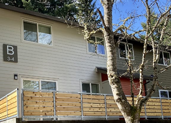 a house with a wooden fence in front of it